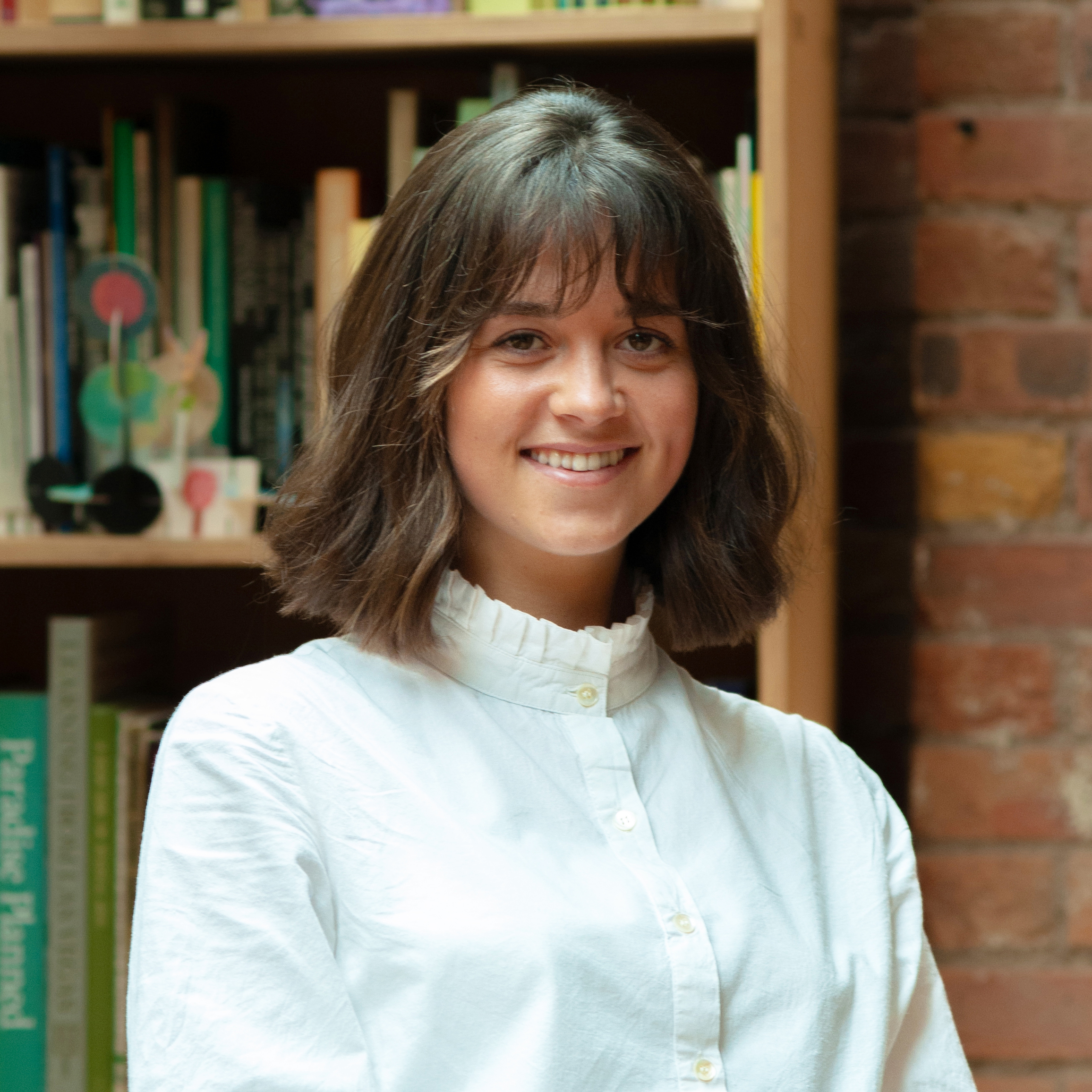 portrait of Molly Hughes in a white shirt